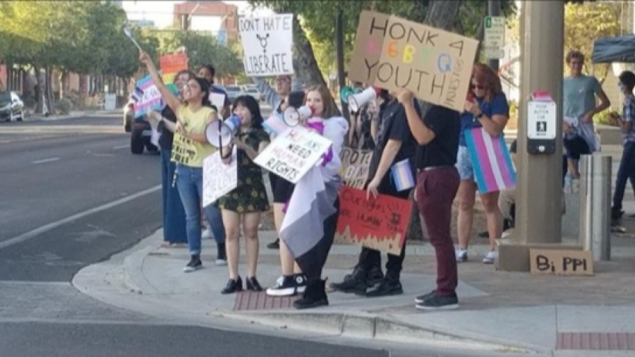 Students protesting outside on street corner