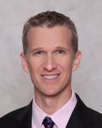 Jeremy Gypton portrait with gray background